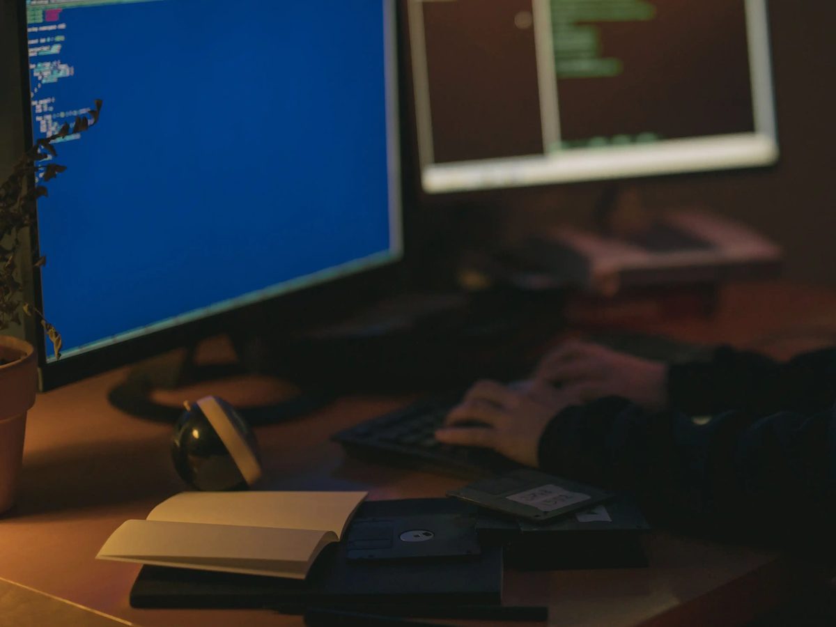 A developer's dual-monitor workstation set up for integration work